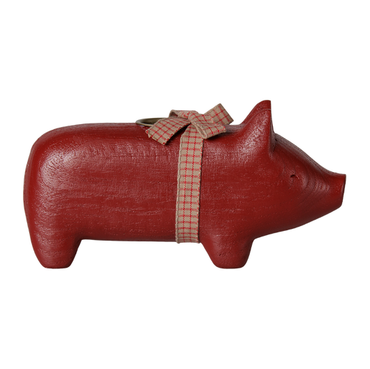 Rotes Holzschwein mit Kerzenhalter und Schleife