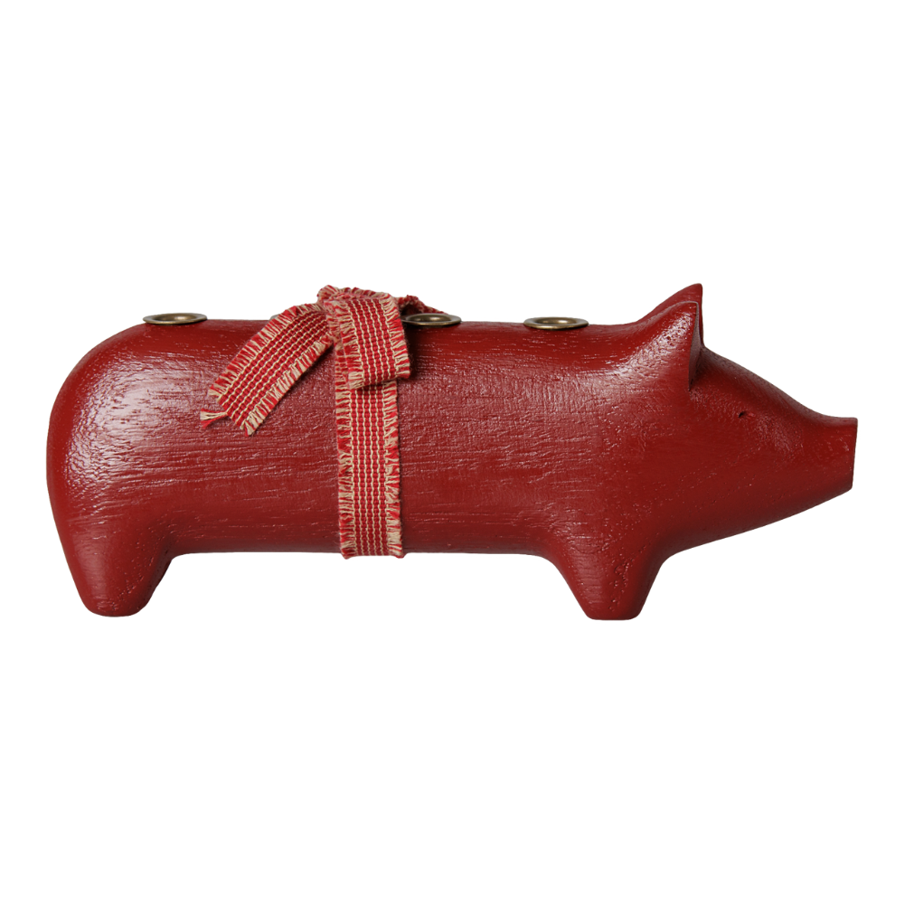 Rotes Holzschwein für vier Kerzen.